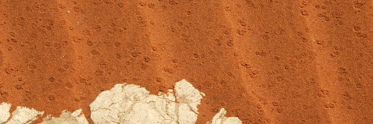 Bild: Regentropfen im Wüstensand Bild: Regentropfen im Wüstensand